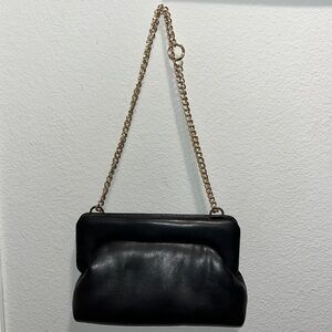 Black purse with gold interchangeable gold chain. Great condition!